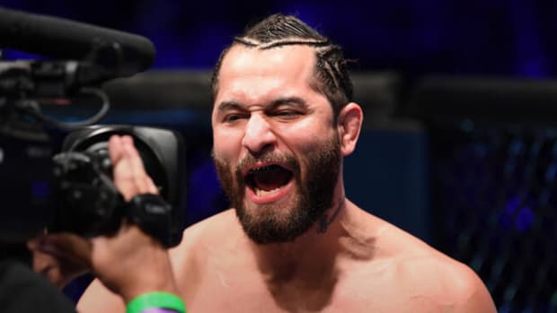 Jorge Masvidal is being introduced by Octagon announcer Bruce Buffer for a UFC pay-per-view event.